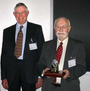 Denis Hall receiving his Award